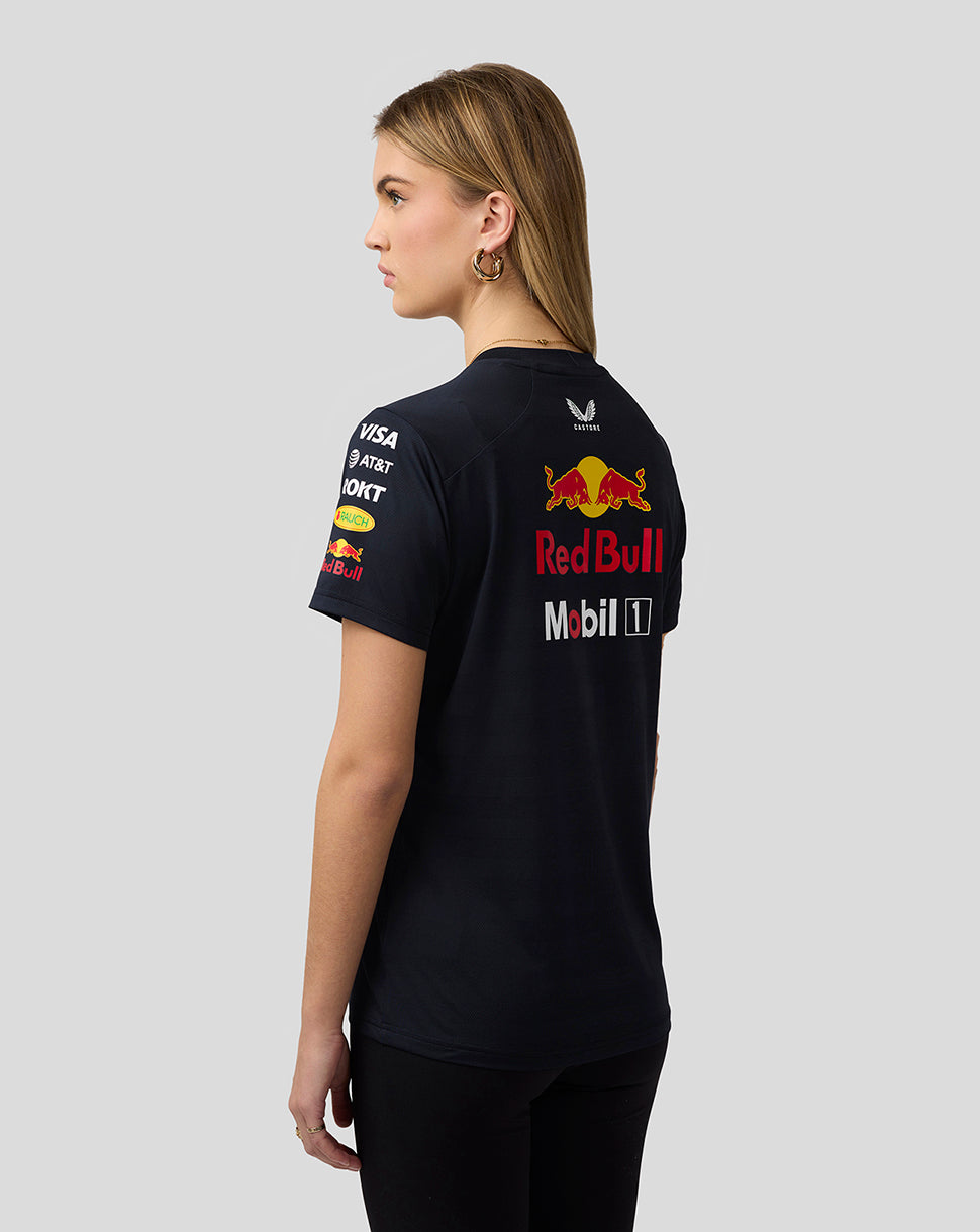 Back view of a woman in navy Set Up T Shirt showing a large Red Bull logo on the back.