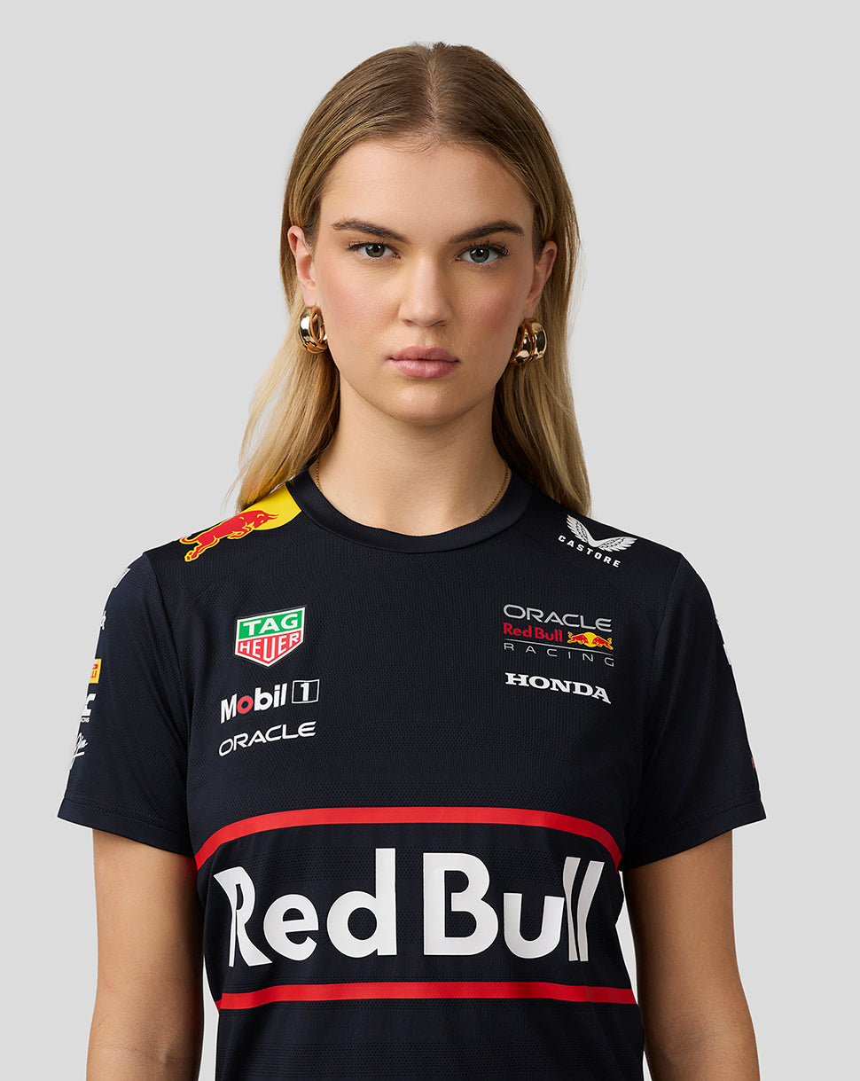 Three quarter front view of a woman wearing navy Set Up T Shirt with bold Red Bull graphic across the chest.