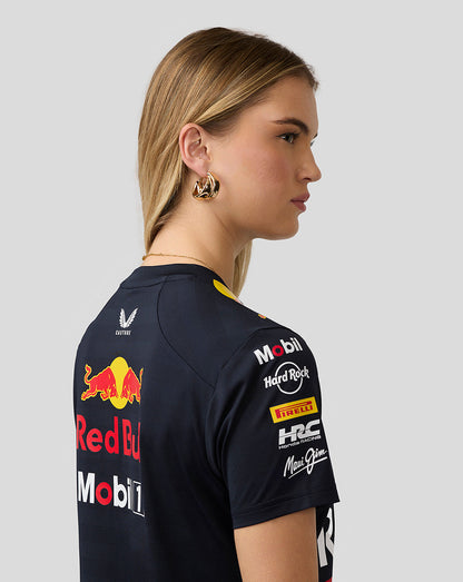 Profile view of a woman wearing a navy Red Bull Racing Set Up T Shirt with back logos.