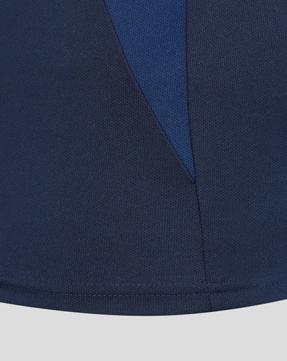 Close up of navy blue fabric with a diagonal seam from the Sydney Roosters 2025 women's pro players presentation polo