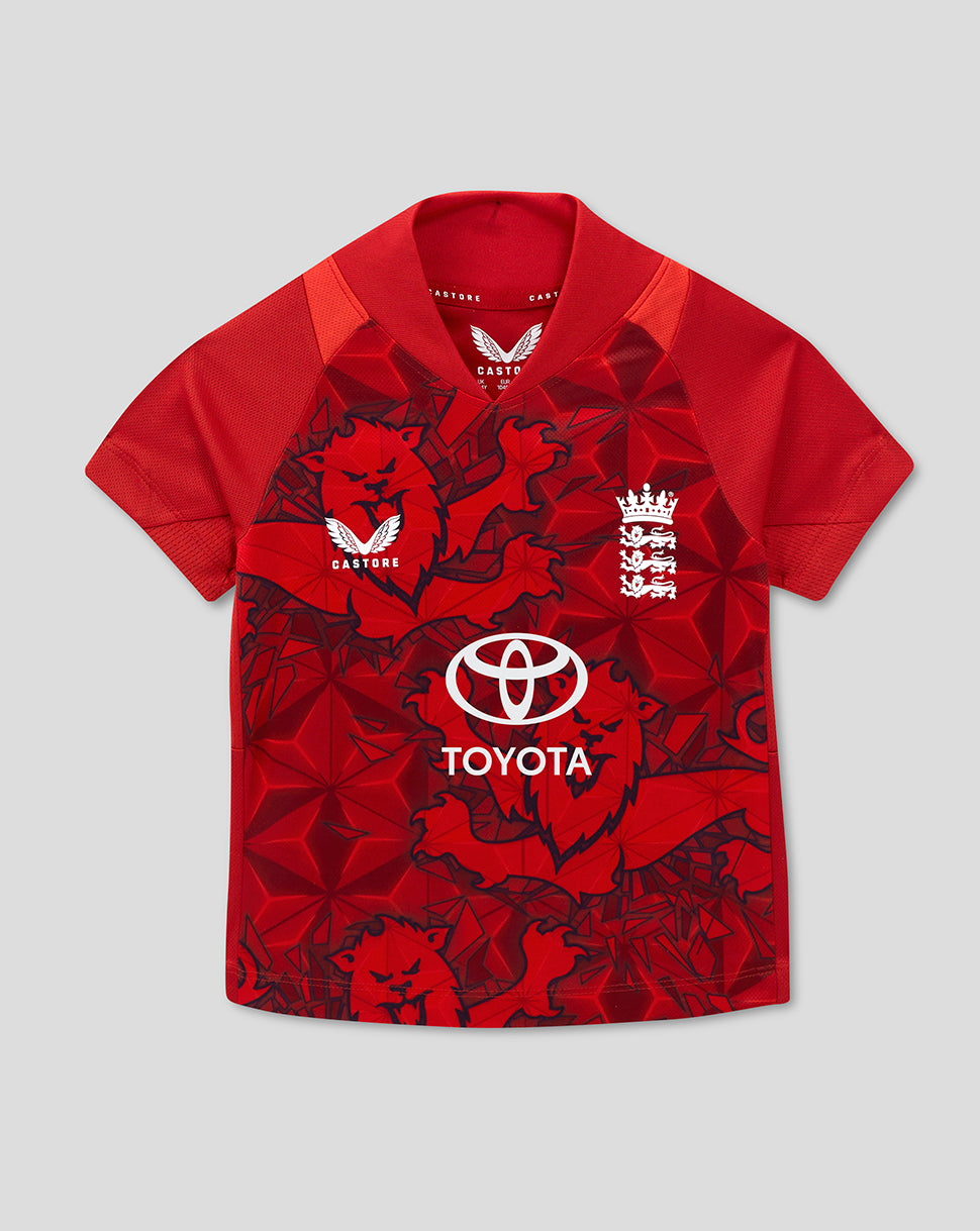 Red England T20 infant cricket shirt featuring a bold lion motif and Toyota sponsorship on a geometric pattern