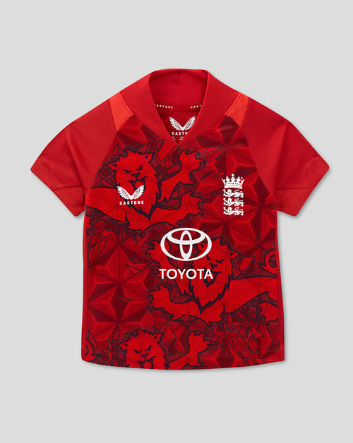 Red England T20 infant cricket shirt featuring a bold lion motif and Toyota sponsorship on a geometric pattern