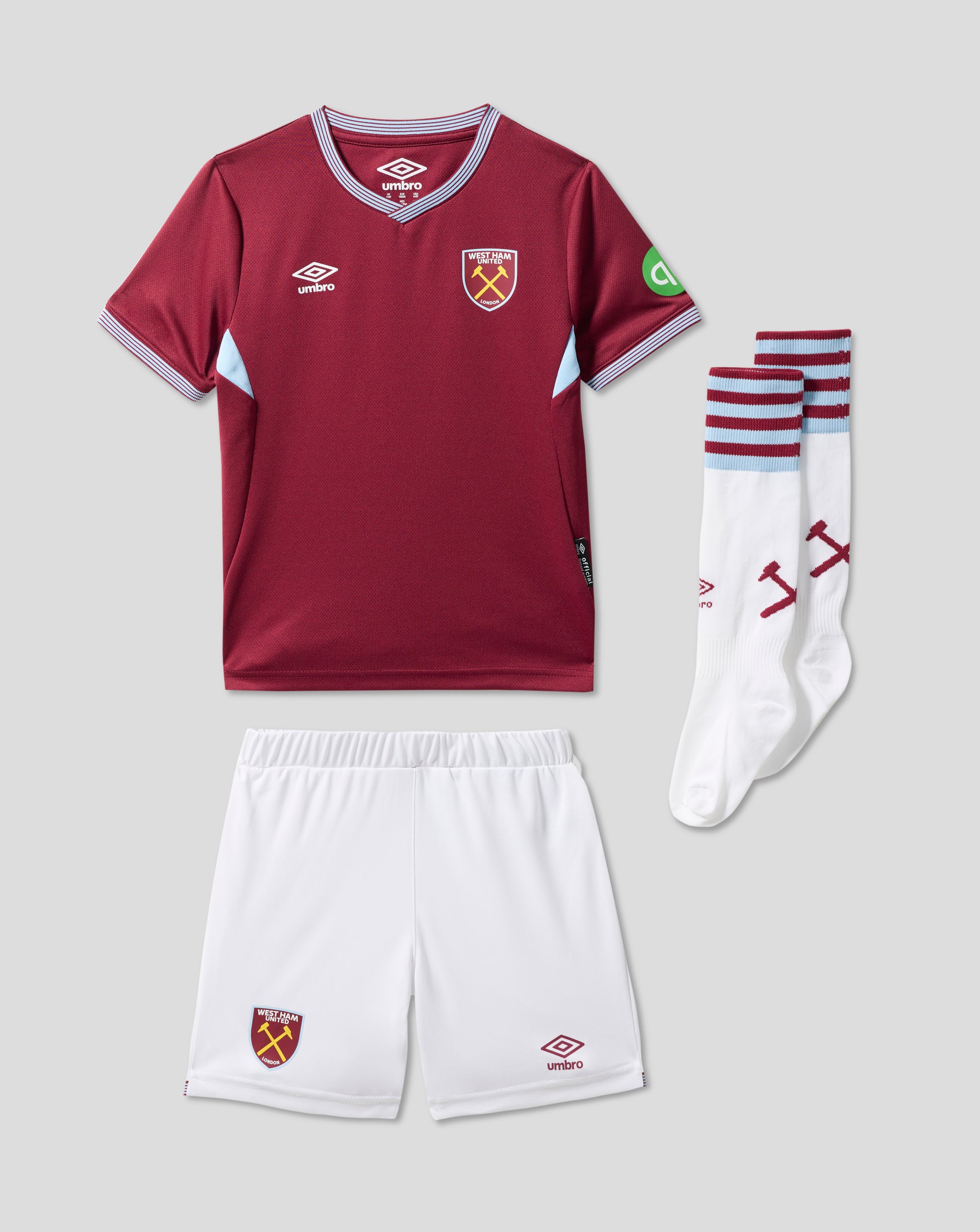 West Ham United infant 25/26 home kit in claret with club crest, paired with white shorts and striped socks.