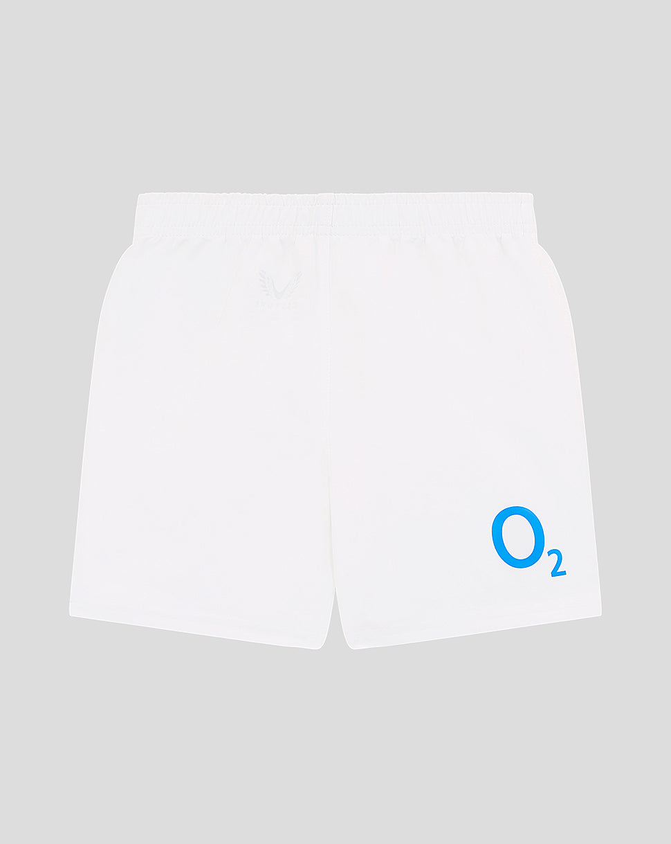 White infant shorts with blue O2 logo on the right leg and a faint crest on the left hip