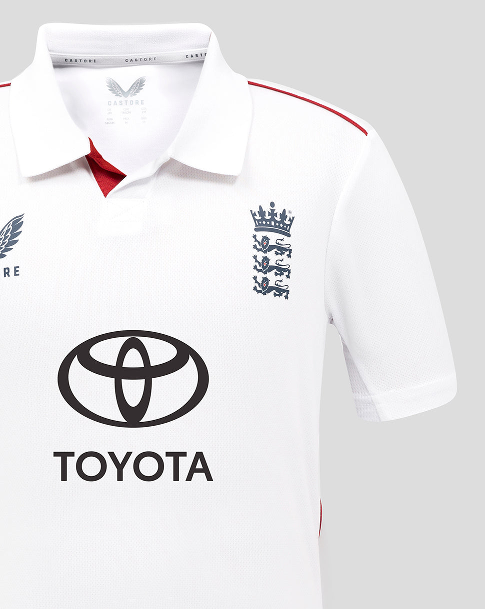 White junior England cricket shirt with Toyota sponsor logo and crest on chest.