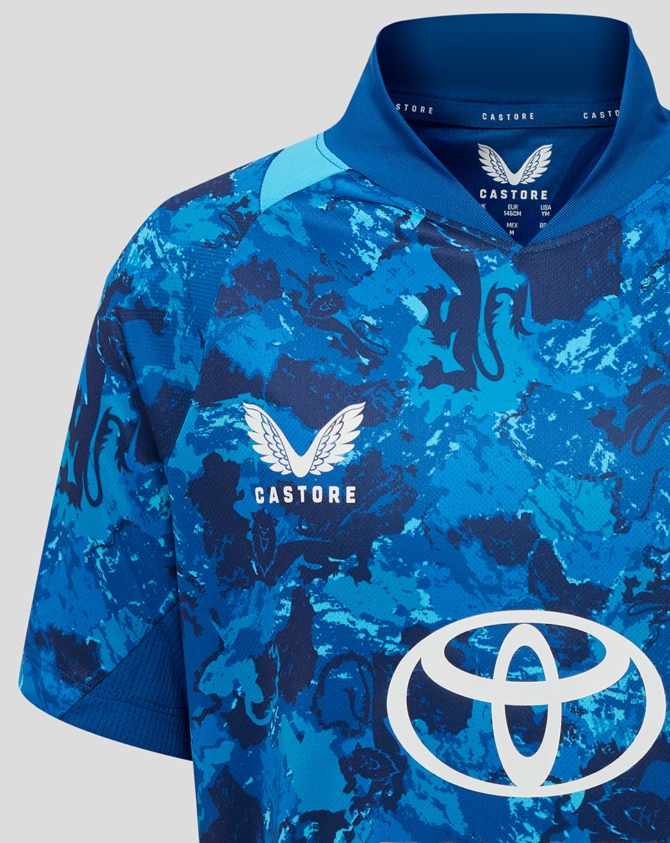 Front close up of blue camouflage England ODI junior shirt with Three Lions crest and Toyota sponsor across the chest.