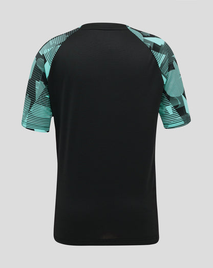 Back view of England Cricket junior training short sleeve tee featuring a black body and turquoise patterned sleeves.