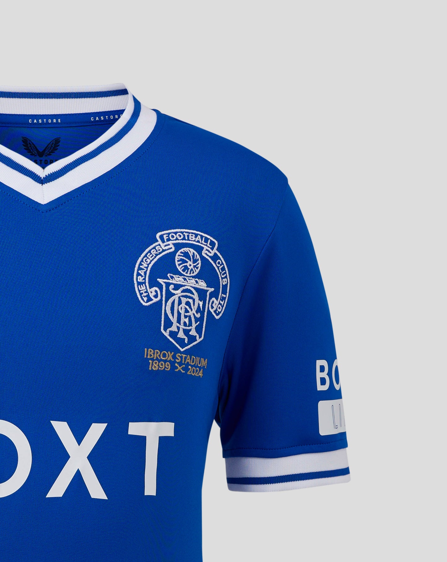 Blue Rangers FC Ibrox 125 Heritage shirt with white striped roll neck collar and club crest on the chest