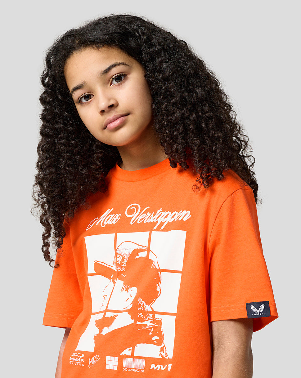 Side profile of a young model wearing an orange Oracle Red Bull Racing Puzzle T Shirt with a bold front graphic of Max Verstappen