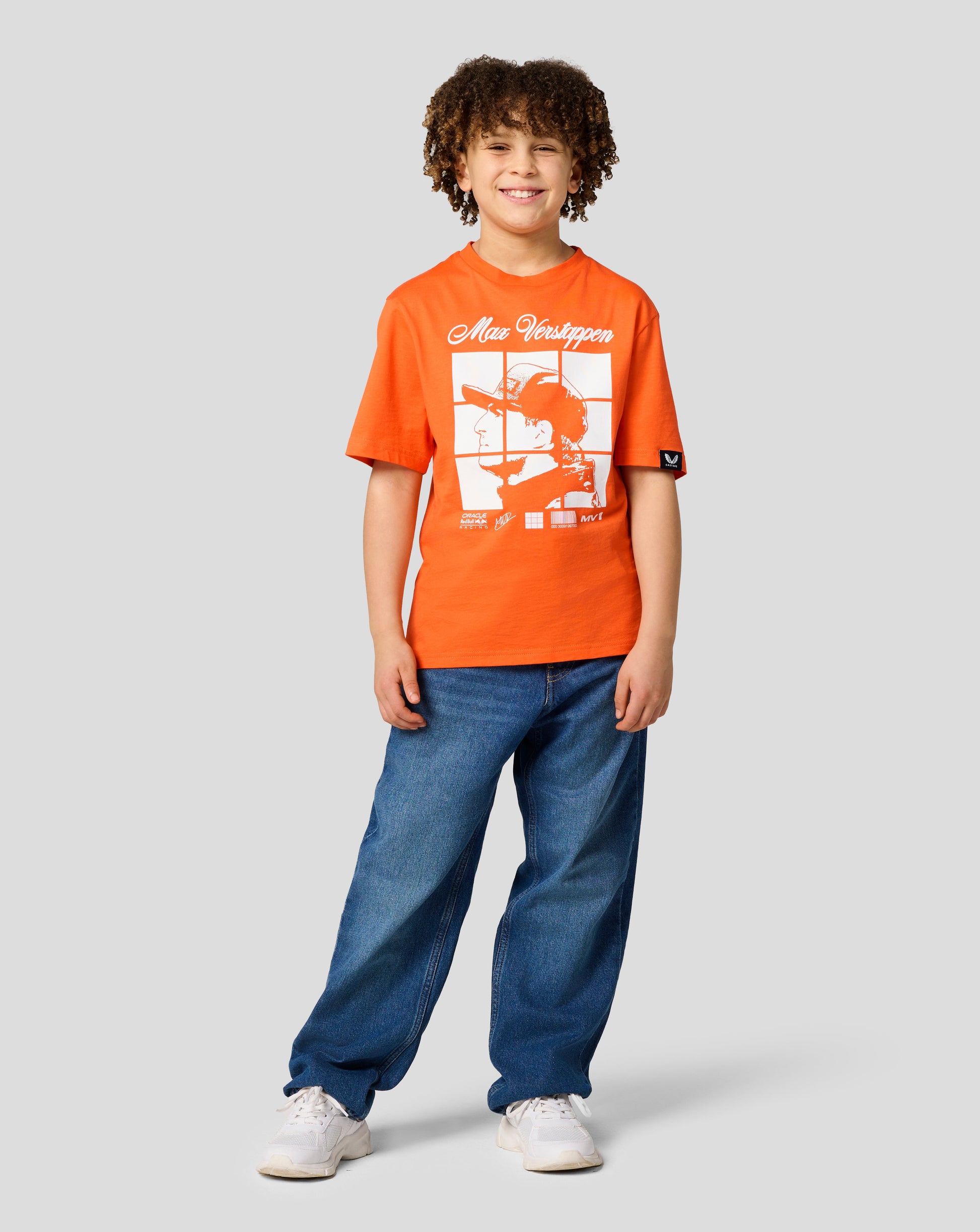 Front view of a smiling child wearing Exotic Orange Red Bull Racing Max Verstappen puzzle T-shirt with a large graphic