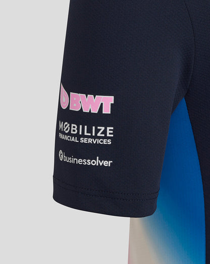 Close up of navy BWT Alpine junior T shirt sleeve with pink BWT logo and sponsor branding