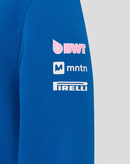 Close-up of the hoodie sleeve showing BWT MTN and Pirelli sponsor logos on lapis blue fabric.