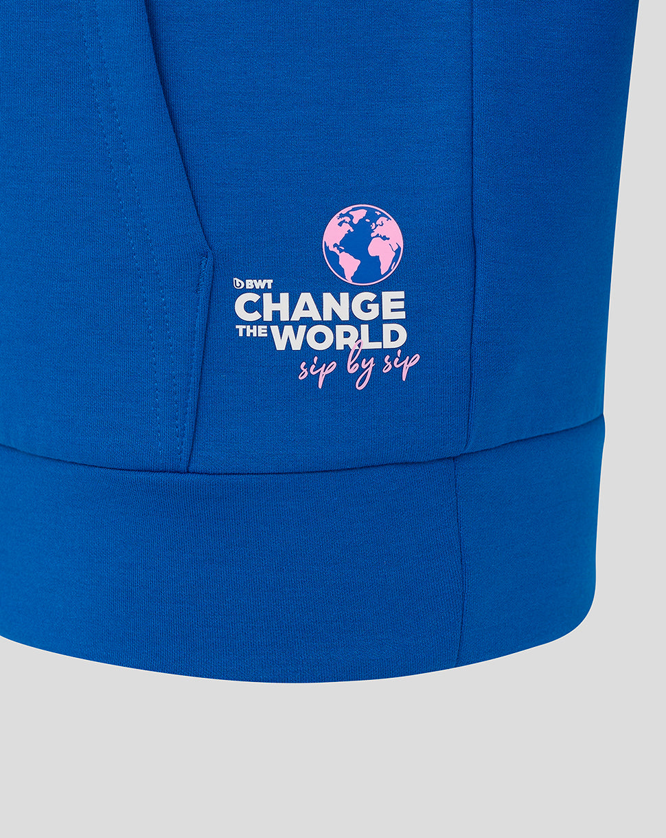 Lower sleeve on blue hoodie featuring Change the World globe logo and sip by sip slogan with sponsor branding