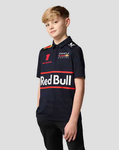 Young boy wearing a navy Oracle Red Bull Racing Junior polo with Verstappen artwork and team logos