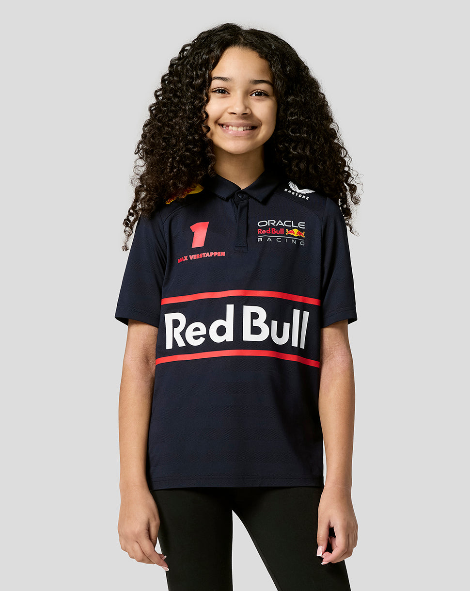 Smiling girl in a navy Red Bull Racing polo with large Red Bull logo across the front