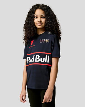 Young girl wearing a navy Red Bull Racing junior t shirt with bold Red Bull branding on the front