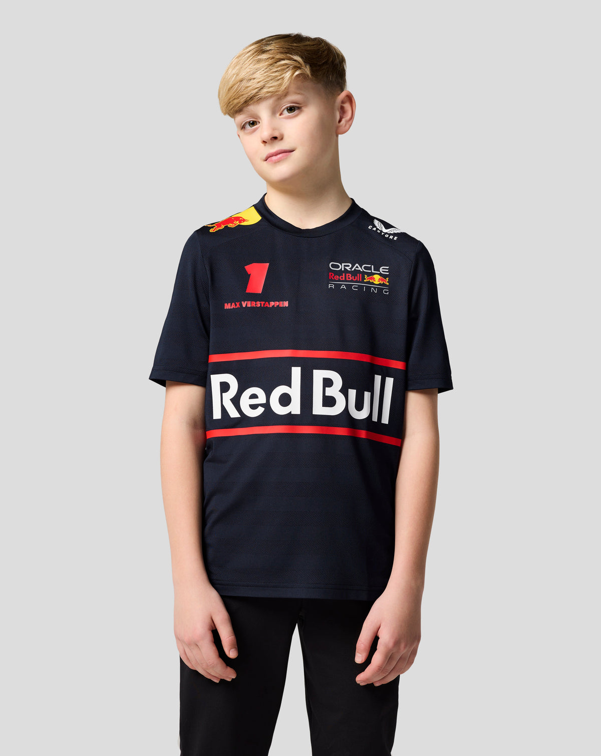 Front view of a young boy wearing a navy Night Sky Oracle Red Bull Racing T shirt with Verstappen number and team logos