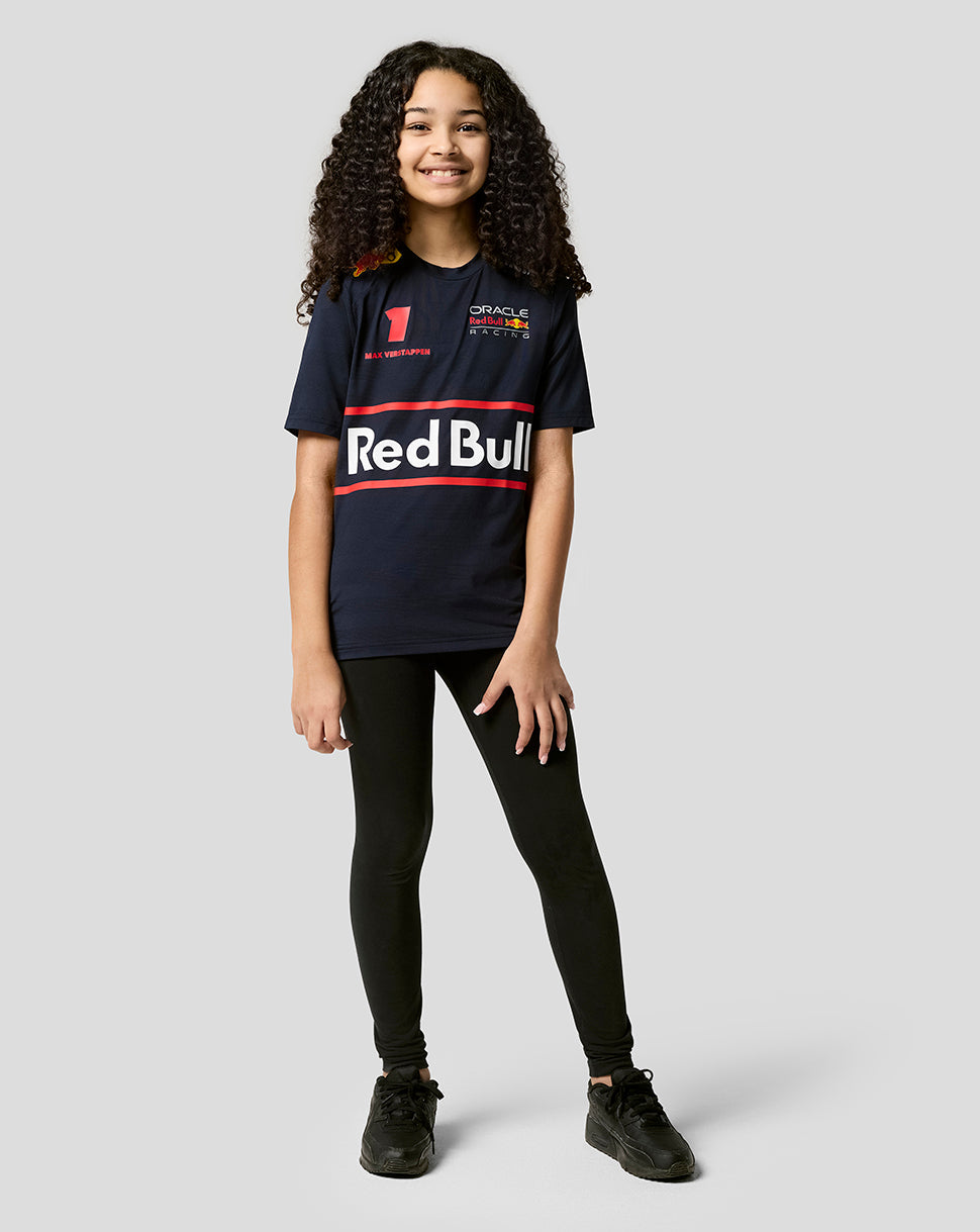 Back view of a young boy in a navy Red Bull Racing T shirt with a large Red Bull logo on the back