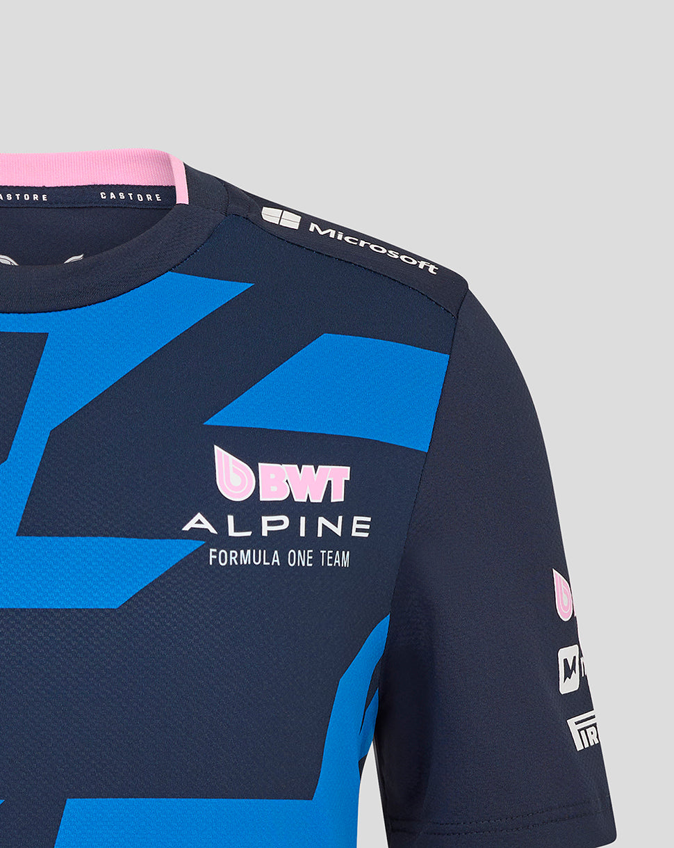 Shoulder close-up of navy Alpine jersey showing pink collar trim blue graphic and sponsor logos including Microsoft.