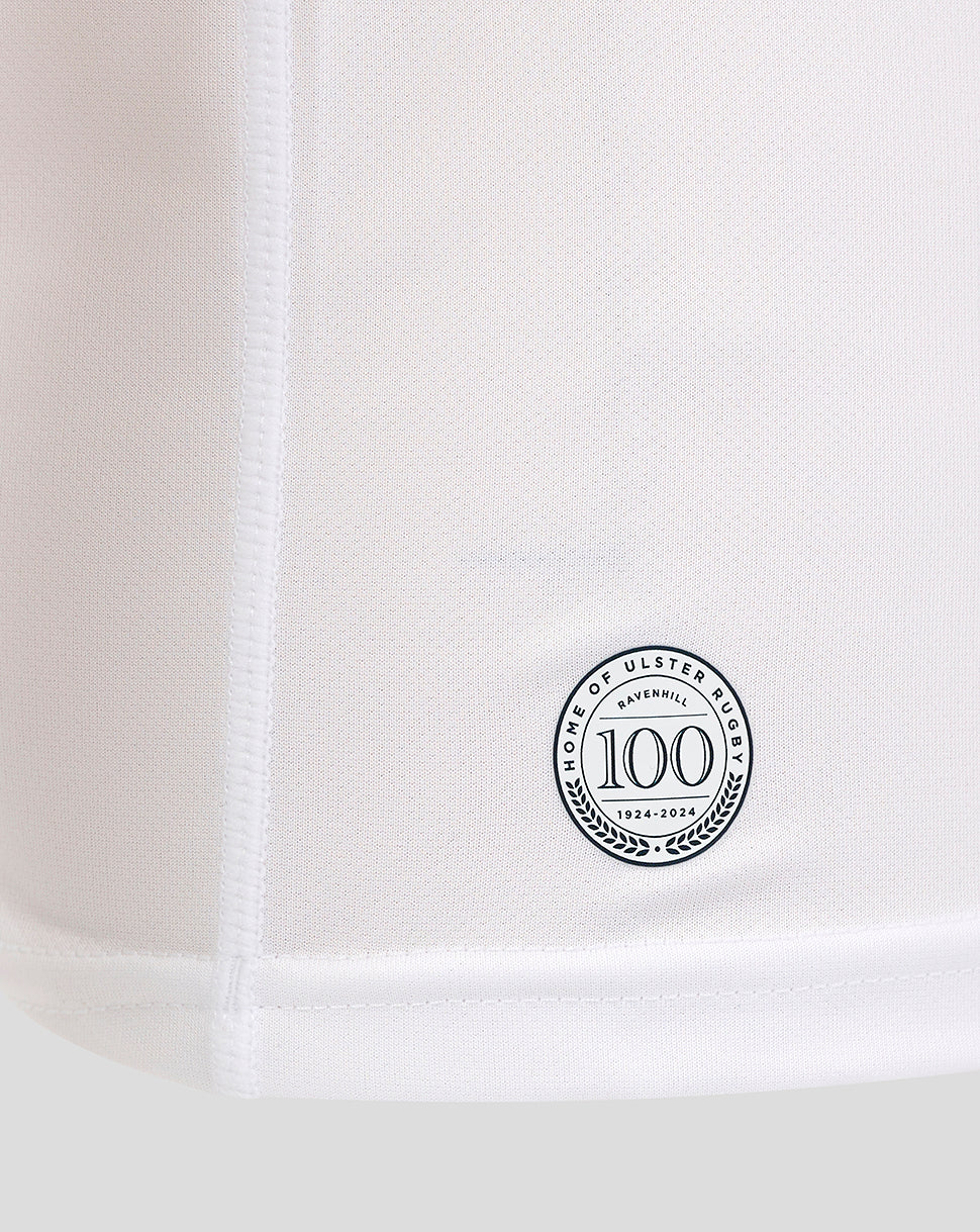 Lower portion of the white Ulster Home shirt showing a circular 100 year badge near the hem