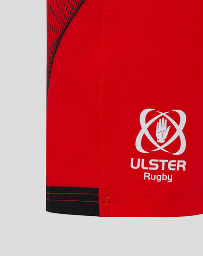 Close-up of red shorts side with Ulster Rugby logo and black trim near the hem