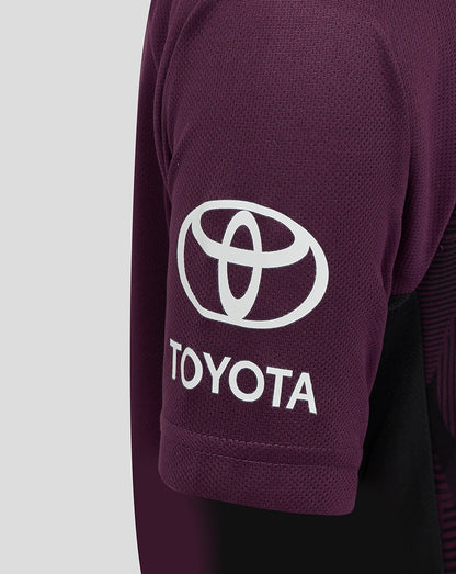 Close up of the purple sleeve showing a white Toyota logo on the jersey.