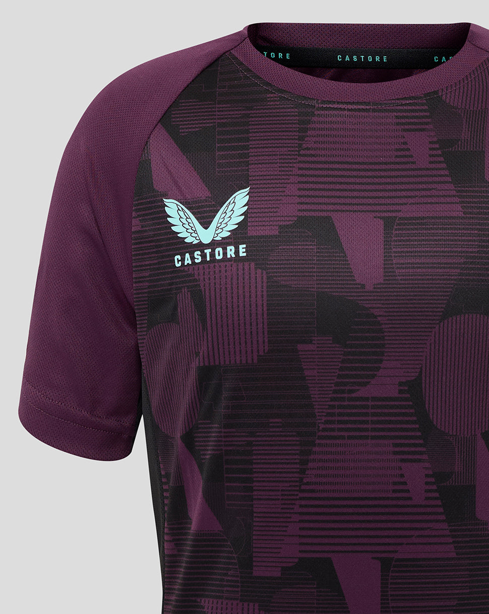 England cricket training junior short sleeve tee in deep purple with geometric print and light blue Castore logo and team crest