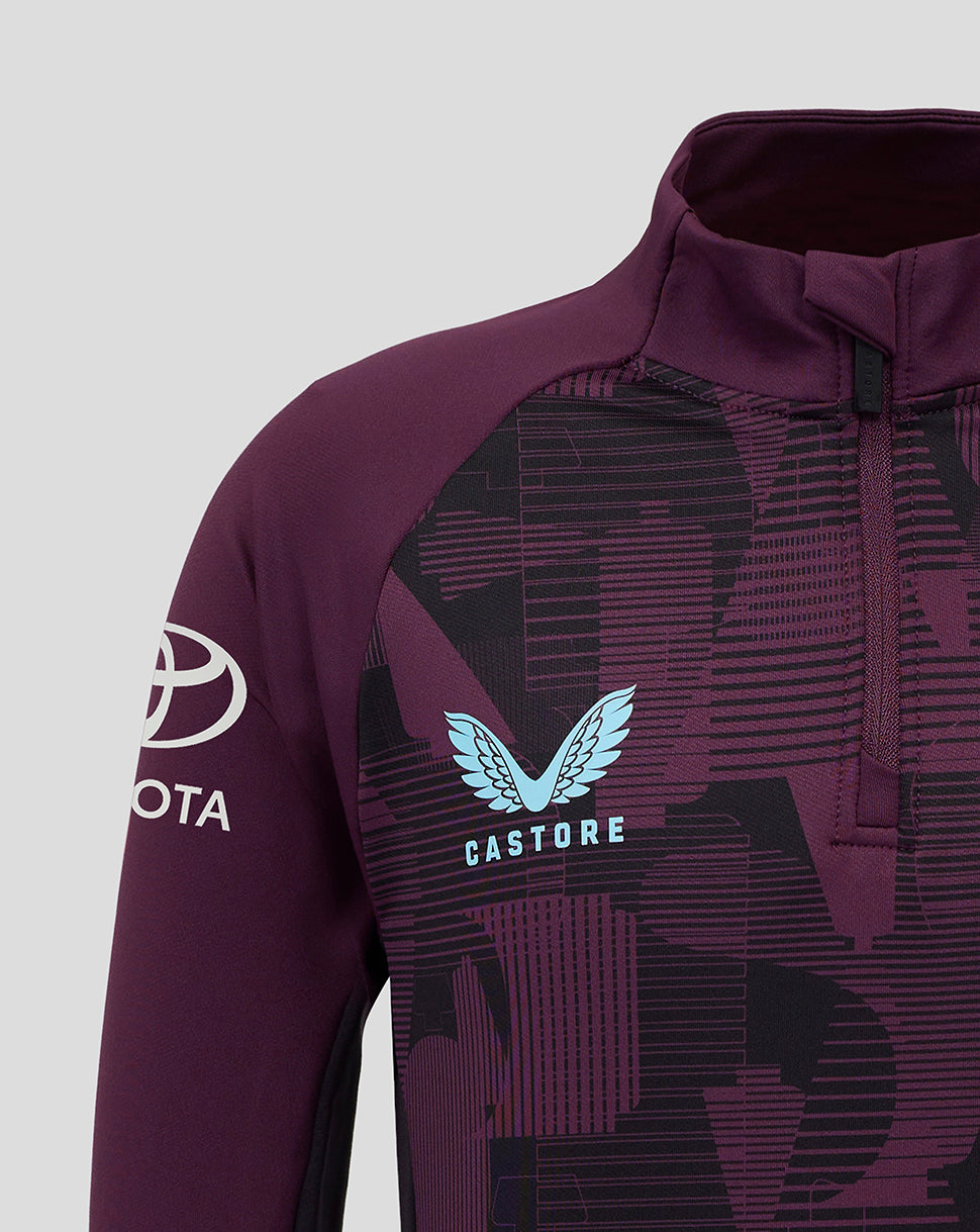 Close up of the purple training top showing a geometric pattern and blue Castore crest on the chest.