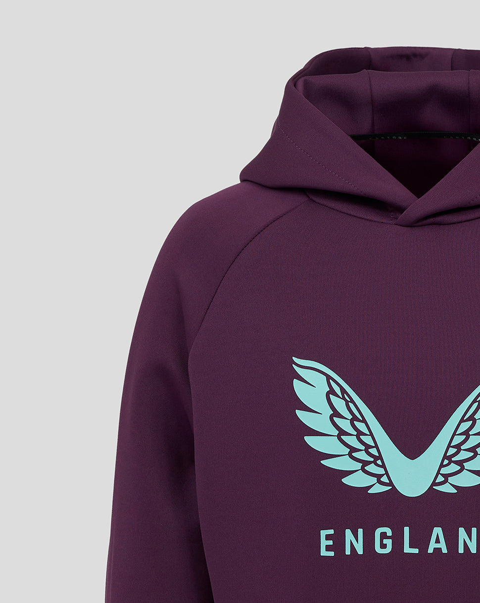 Close up of the hoodie front chest showing a light blue England crest wings logo on purple fabric