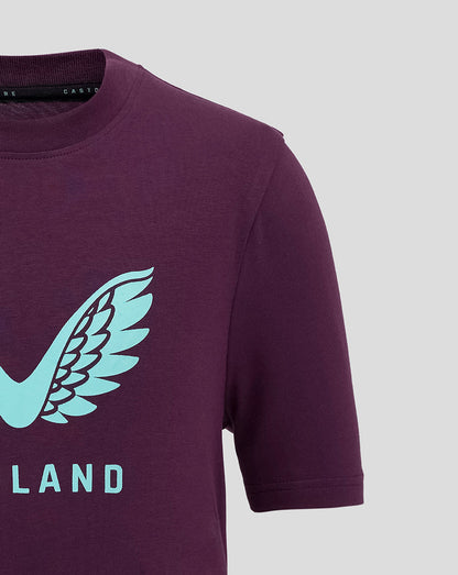 Close-up of the maroon England cricket tee showing the light blue wing logo and partial ENGLAND lettering