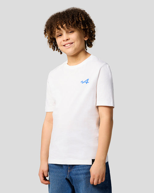 Child wearing a brilliant white Alpine Graphic T-shirt with a small blue logo on the chest.
