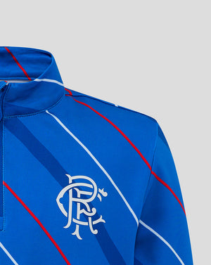 Rangers Junior 25/26 Home Matchday top close up of collar and embroidered club crest on blue fabric