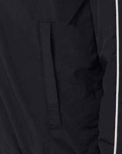 Pocket detail on black Rangers Junior travel track jacket