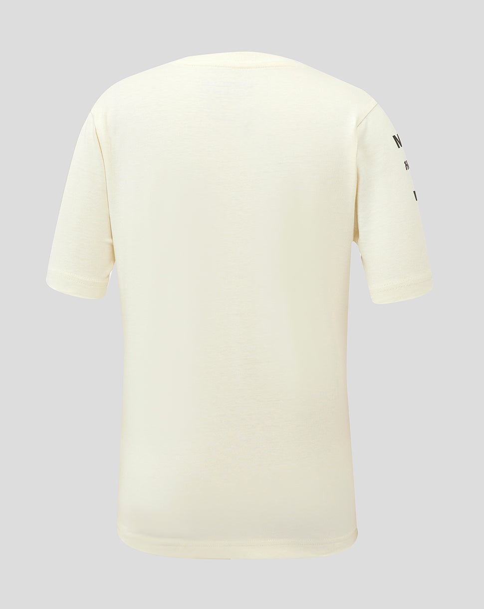 Back view of a cream colored Junior Heritage Team T Shirt with branding on the sleeve