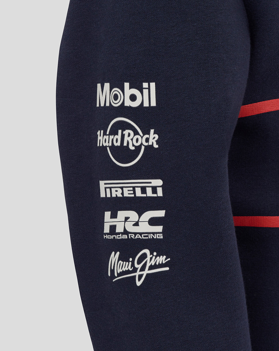 Navy hoodie sleeve featuring Mobil Hard Rock Pirelli Honda Racing and Maui Jim logos with a red stripe.