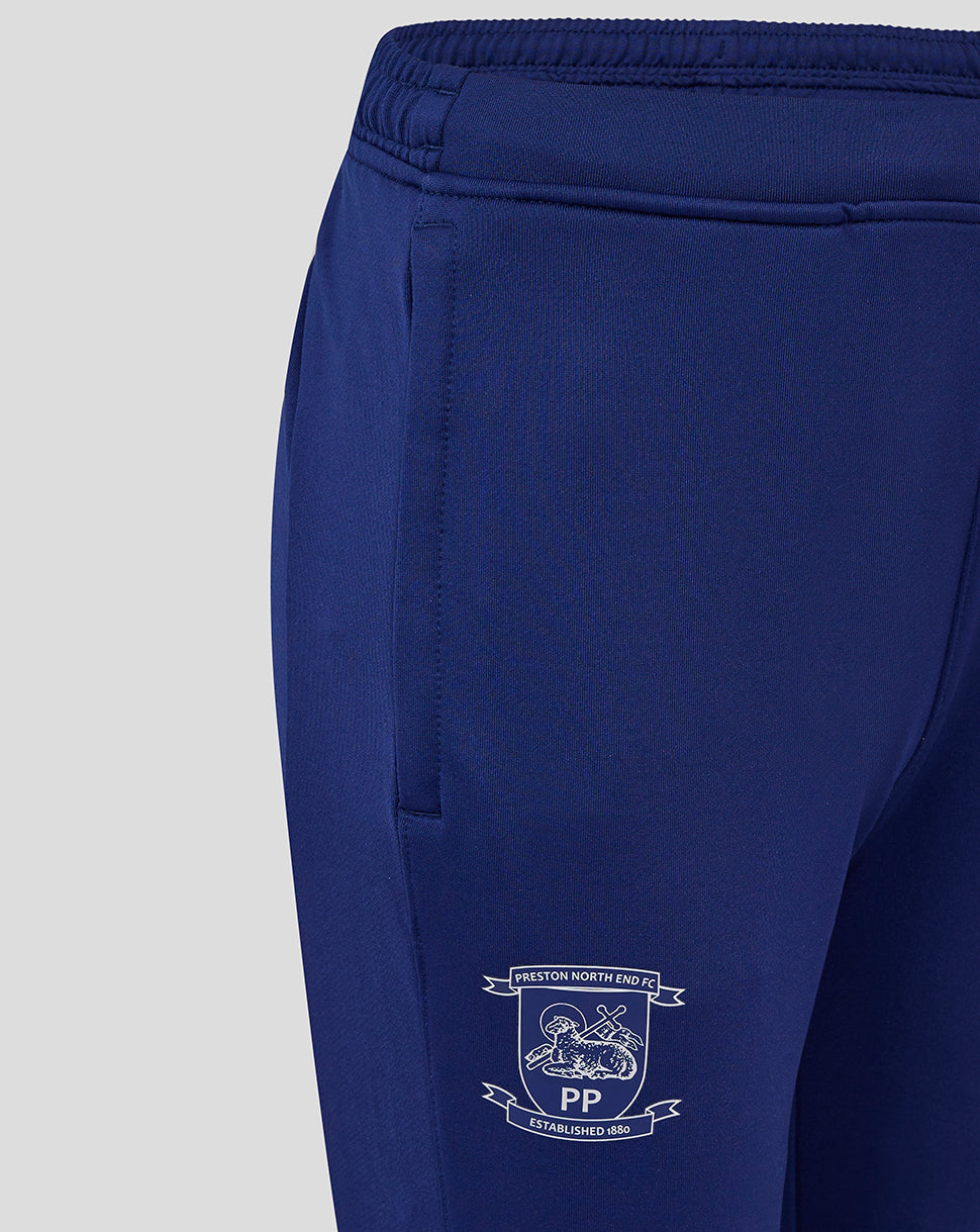 Blue Preston North End FC junior training knit pants with club crest on the leg.