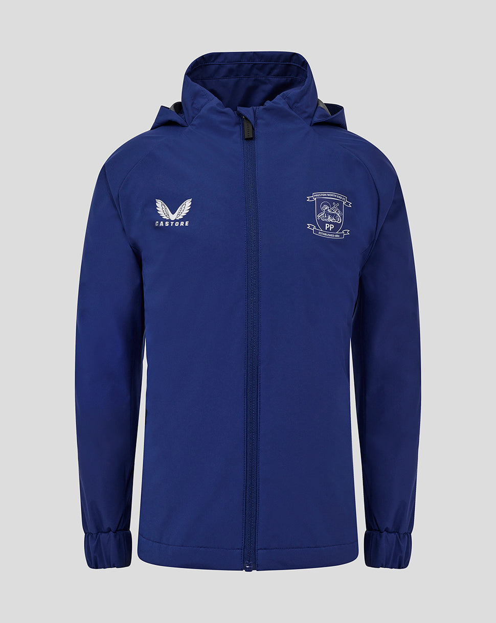 Front view of blue Preston North End junior training packable hood shower jacket with club crest and Castore logo