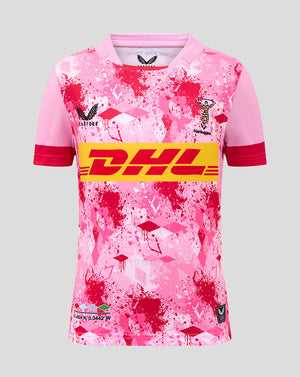 Front view of Harlequins Junior 25/26 Away Replica Shirt in pink with a bold DHL logo across the chest.