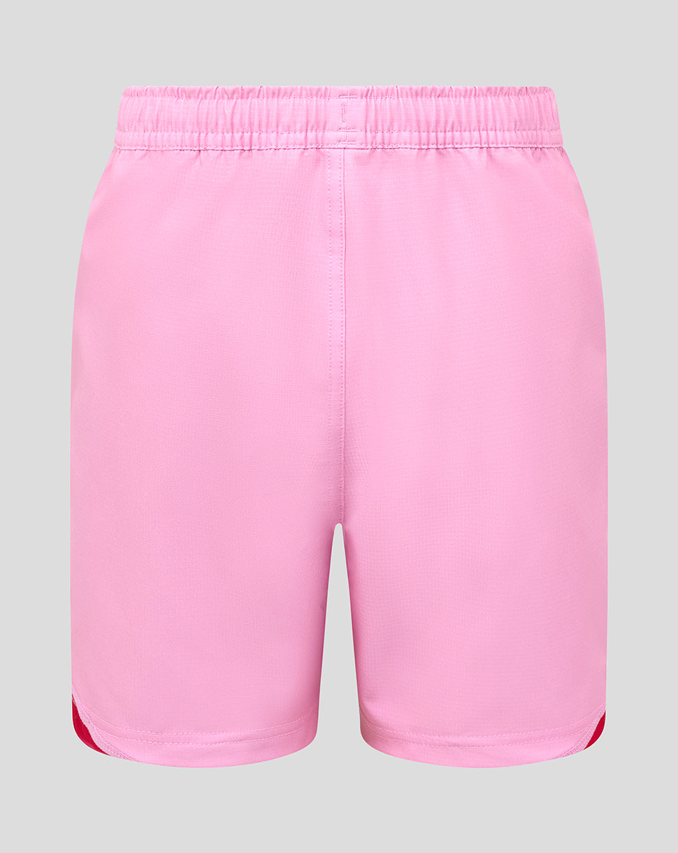 Back view of pink Harlequins junior away replica shorts with an elastic waistband and red side accents at the leg openings.