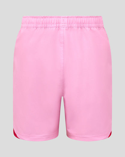 Back view of pink Harlequins junior away replica shorts with an elastic waistband and red side accents at the leg openings.
