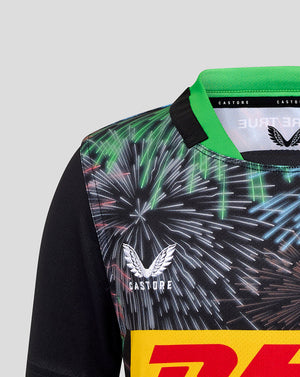 Close-up of the Harlequins Juniors Big Game Replica Shirt neckline with green collar black sleeves and fireworks print