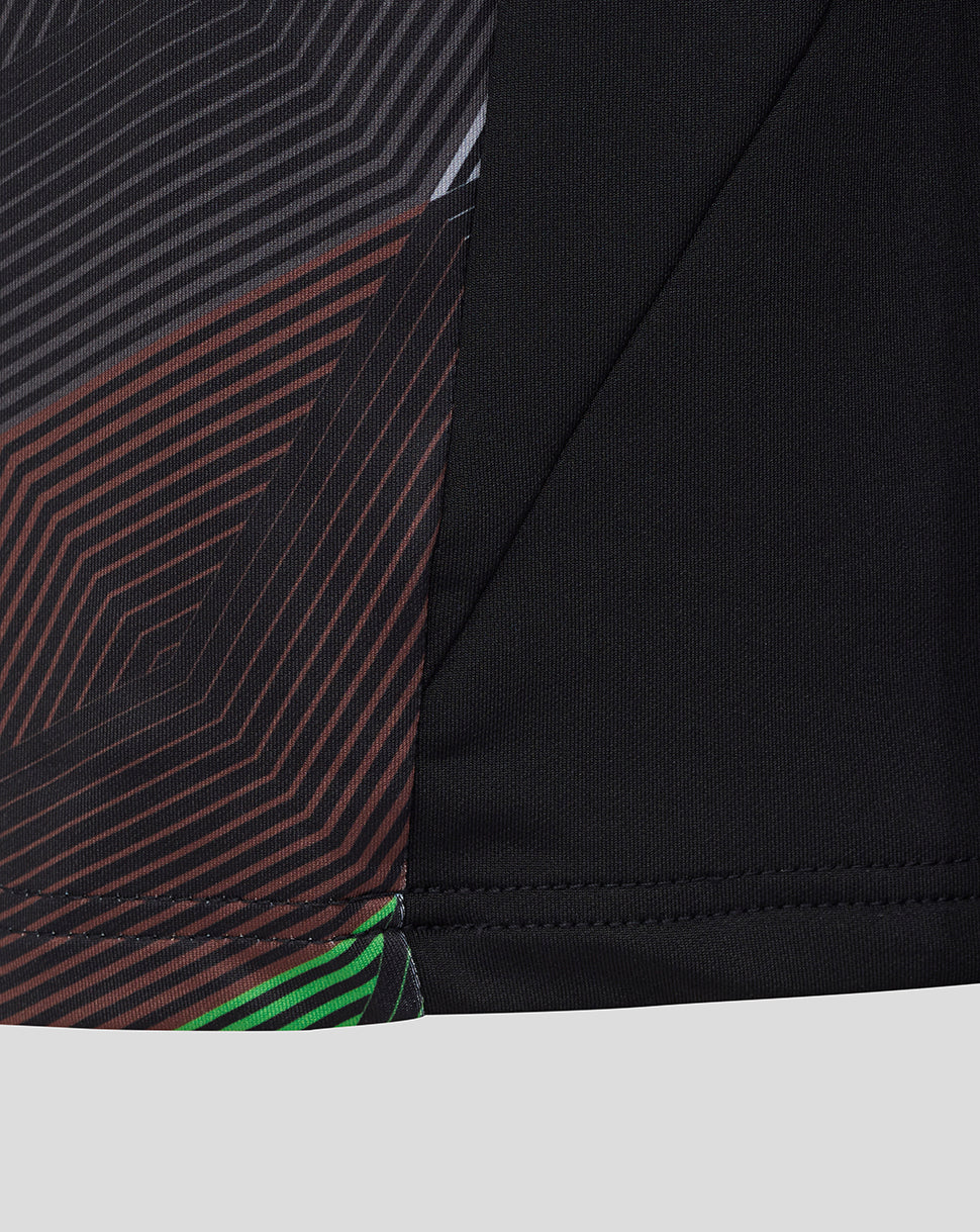 Lower front panel of Harlequins junior quarter zip top with diagonal stripe pattern and black sleeve