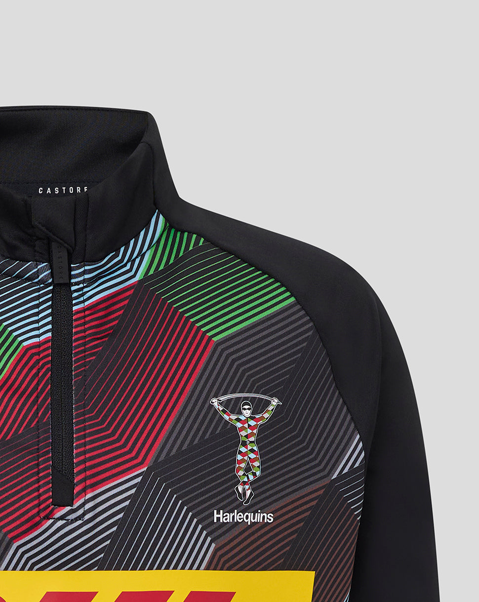 Upper chest and collar view of Harlequins junior quarter zip top showing vibrant geometric print and club crest