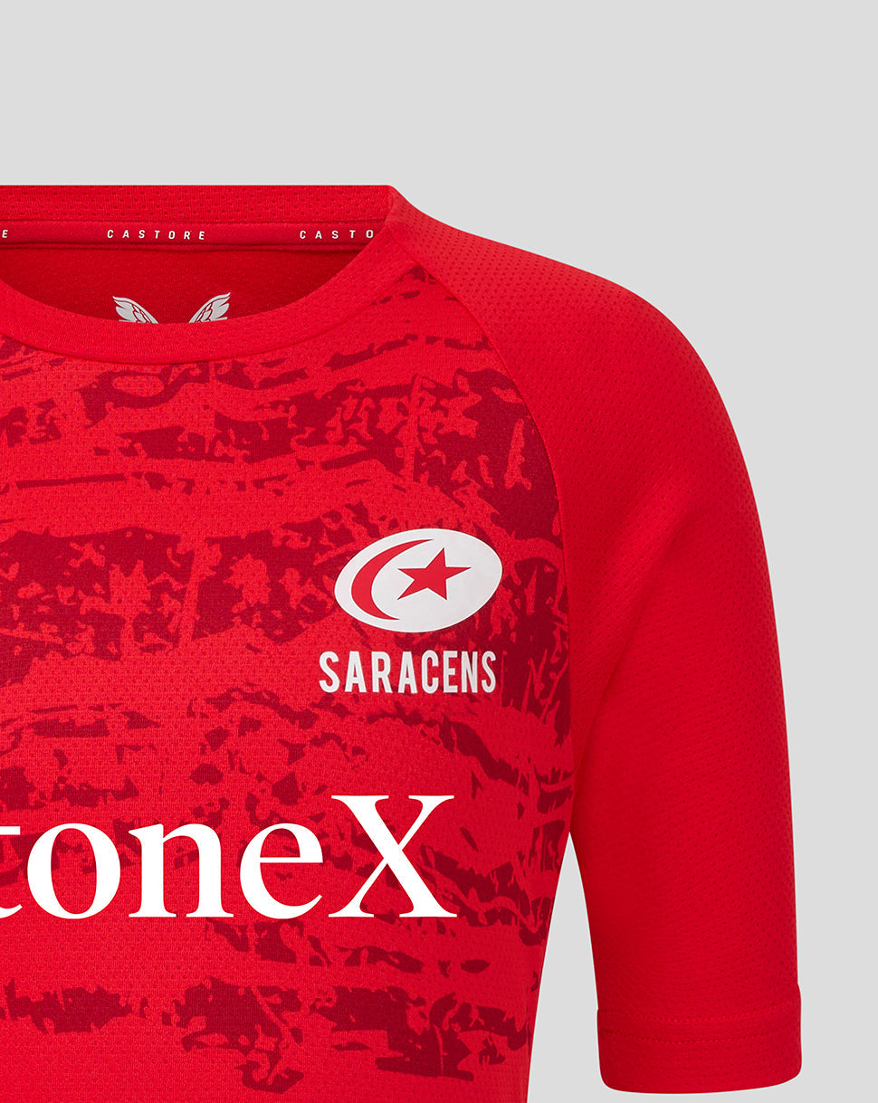 Red Saracens Junior short sleeve tee featuring white crest and StoneX sponsor logo across the chest and a textured pattern