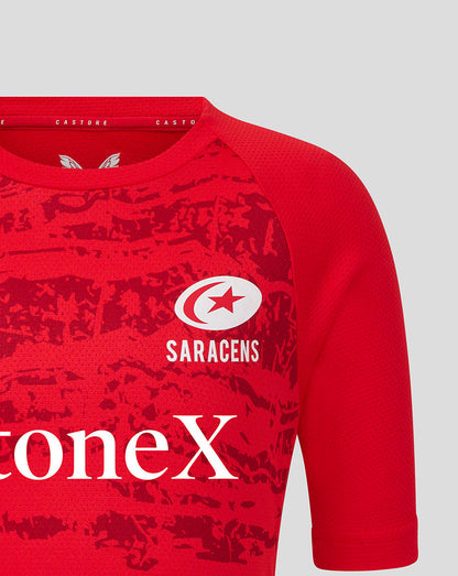 Red Saracens Junior short sleeve tee featuring white crest and StoneX sponsor logo across the chest and a textured pattern