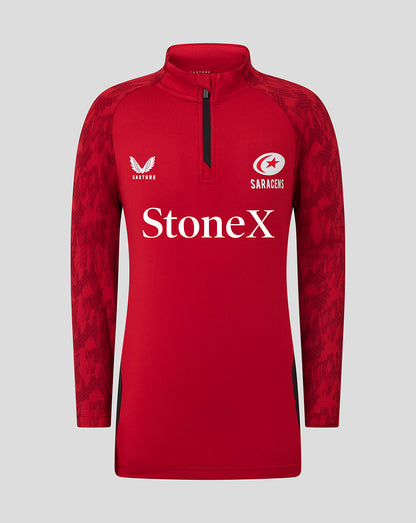 Red Saracens junior training top with quarter zip, white StonEx sponsor across the chest and patterned sleeves.