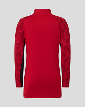 Back view of red Saracens junior training top with patterned sleeves.