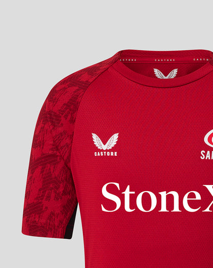 Red Saracens training tee with white crest on left chest and StoneX across front