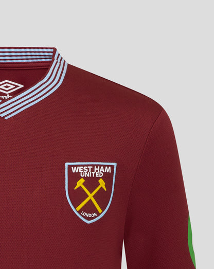 Close up of maroon West Ham Junior 25/26 shirt collar with light blue striped trim and West Ham United crest