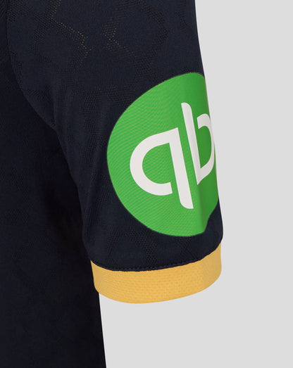 Close-up of navy West Ham Junior 25/26 Third Kit shirt showing a bright green sponsor patch on the side